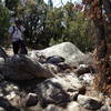 Lance trying to figure out what to do with the embedded boulders