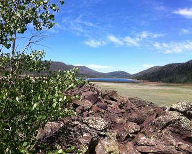 Looking back to the lake from the lava flow. The lake experiences low water by late summer many years with the east side drained by lava tubes.