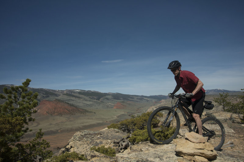 Step up to the view on Above the Law with the Red Butte and Trail Creek in the background.