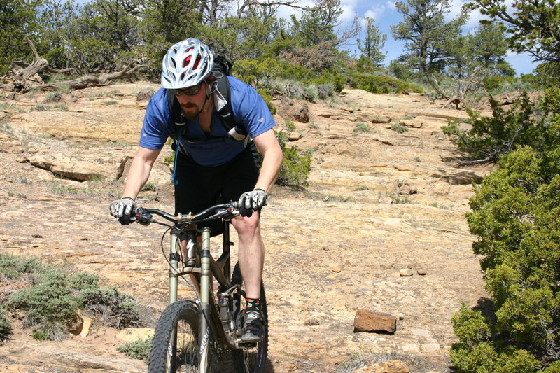 The slickrock descent from the summit of Above the Law.