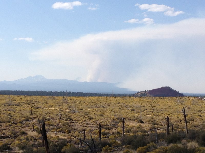 Cascade Range with Pole Creek Fire in the distance.