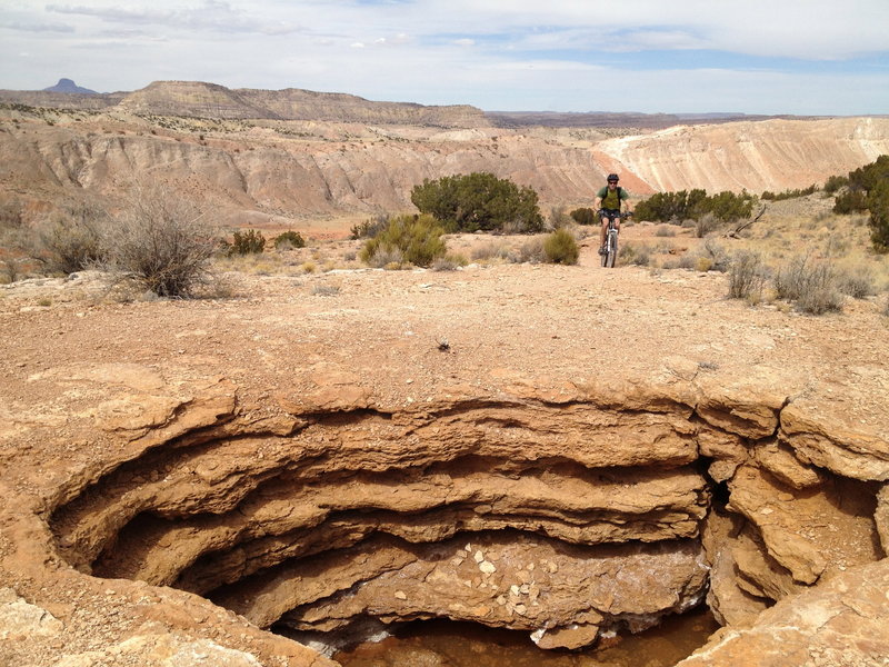 Deep hole-like cesspool right on the side of the trail.