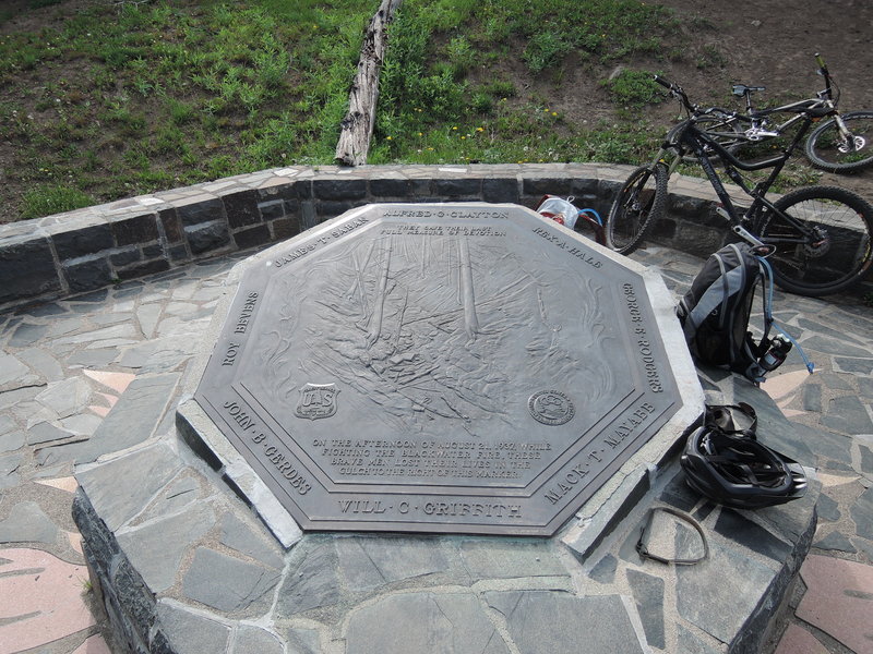 The memorial. It's an eerie image of discarded water packs and equipment. You just moments ago crossed the gulch and were only feet from the spot where these men lost their lives.