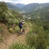 Starting the descent, with views of Vail and the Gore Range.