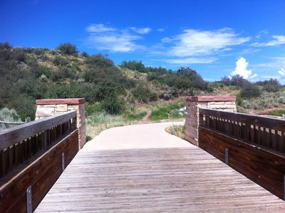 Start of the Moore Open Space trail singletrack, taken from bike path bridge over Maroon Creek Rd.