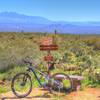 Bench for catching your breath and enjoying the view at the intersection of Coachwhip and Windmill trails