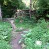 Path over wall and through farmhouse