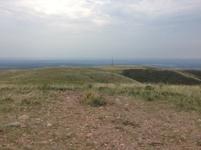 The view from the top of the mountain, a long way traveled with the radio tower and service road visible