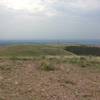 The view from the top of the mountain, a long way traveled with the radio tower and service road visible