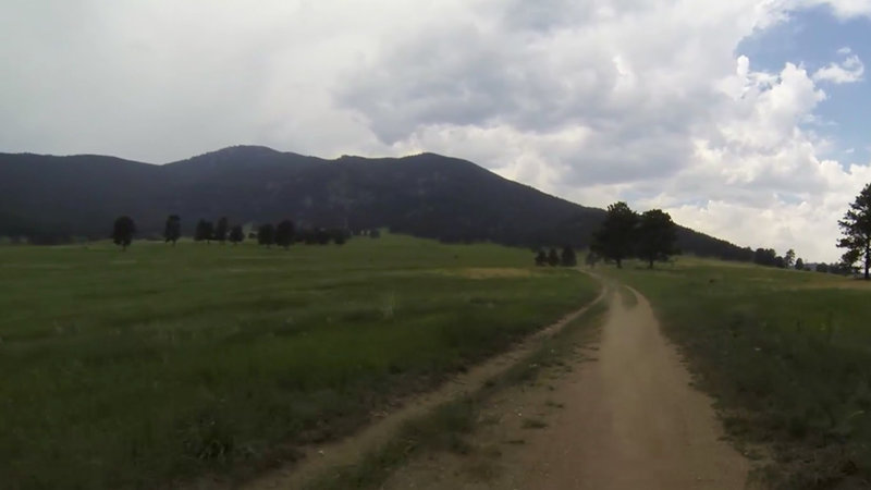 Out into the meadow on a fast, wide trail with a view of Bergen Peak.