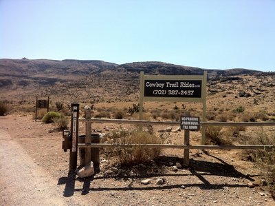 The trailhead to Cowboy Trails. The phone # is for horseback riding.