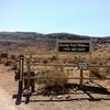 The trailhead to Cowboy Trails. The phone # is for horseback riding.