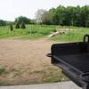 Looking out at the skills park past one of the grills available for use at the brand new trailhead facilities (as of 2012).