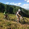 Flagstaff emerges from deep forest into beautiful meadows.