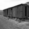 A decrepit old railcar sits along side the rail trail near mile six.