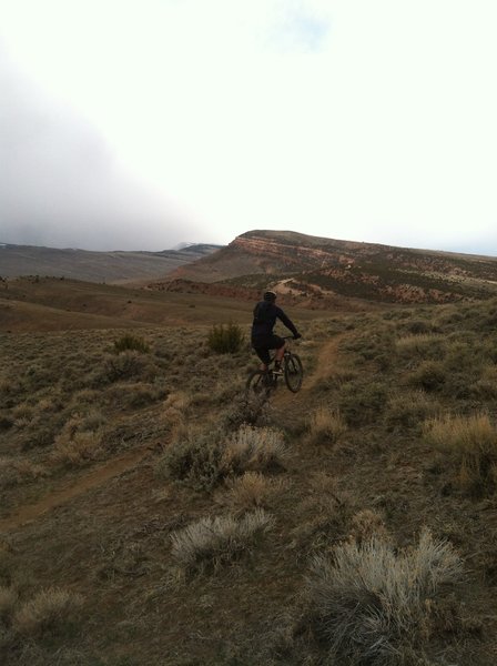 Jeff climbs the G & T before a spring storm moves in. Facing North.