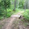 Short arched bridge on Troll Loop at Michigan Tech's Tolkien Trails.