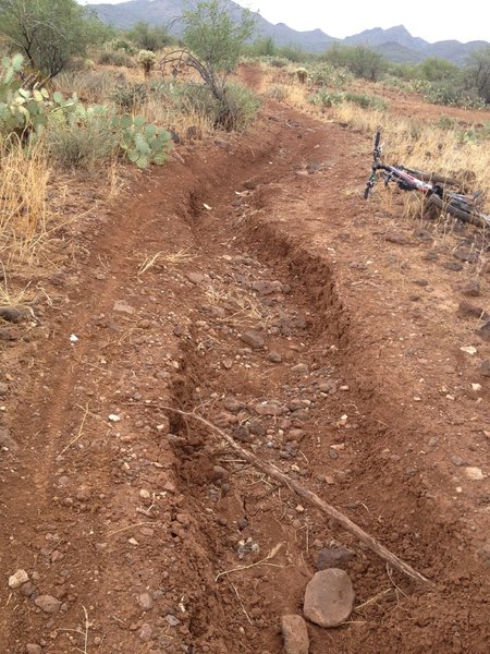 Heavy erosion from the summers storms. Watch out here or your day could go south in a hurry. This is what happens when you do not use the IMBA  trail building guidelines. This section has to be repaired every year.