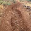 Heavy erosion from the summers storms. Watch out here or your day could go south in a hurry. This is what happens when you do not use the IMBA  trail building guidelines. This section has to be repaired every year.