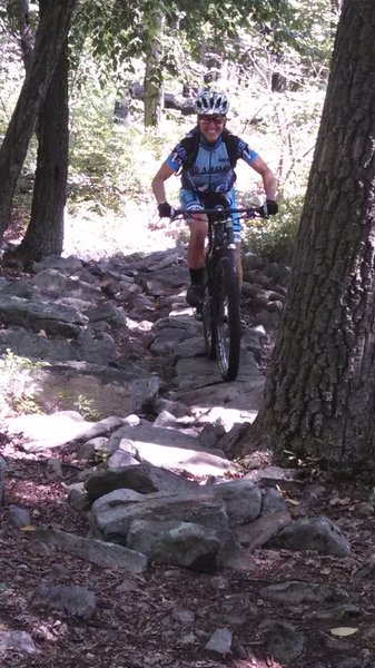 Tara riding the rock bridge.