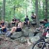 NMBA members taking a break on the natural rock benches after a hot humid climb on Deer Tick before continuing on to Beautiful trail