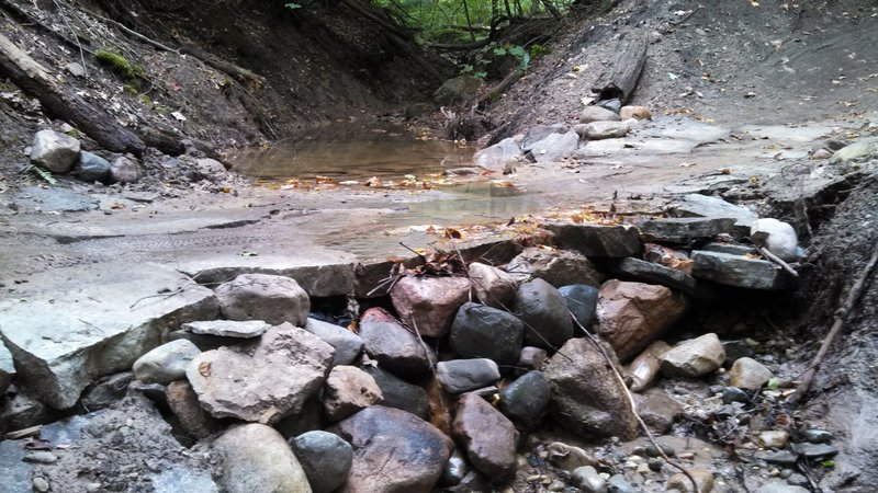 Flagstone creek crossing with waterfall