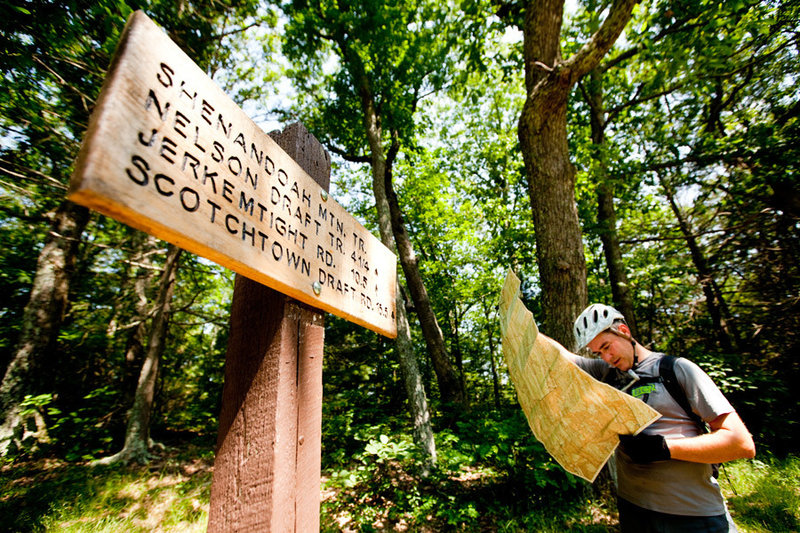 Checking the map at the intersection of Benson Run Rd and the Shenandoah Mountain Trail. Take a left to ride towards an 11 mile singletrack traverse