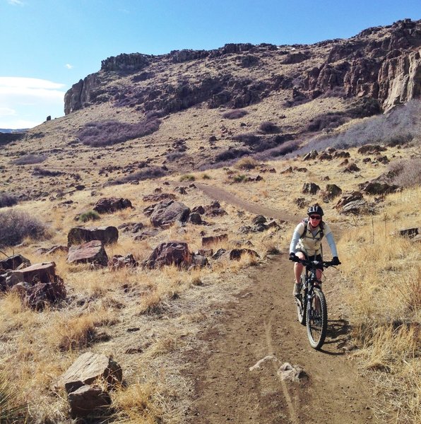 Along side the basalt cliffs, between downhill sections on the south end of North Table Loop Trail