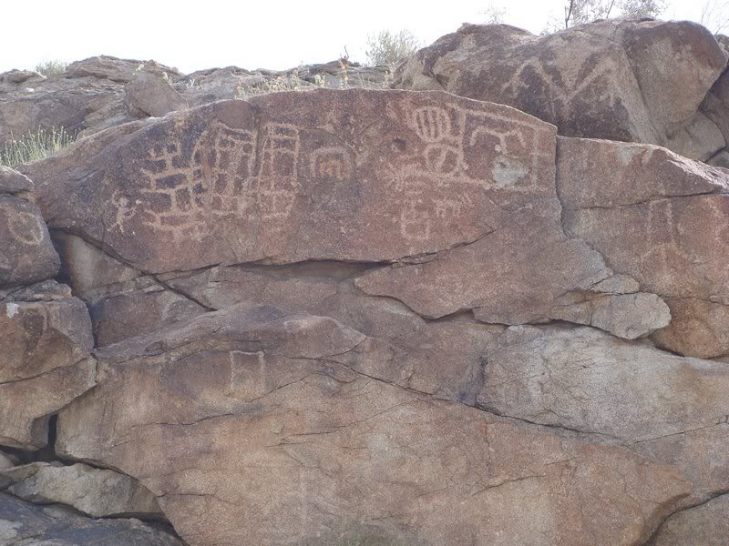 Native American Petroglyphs opposite the murals.