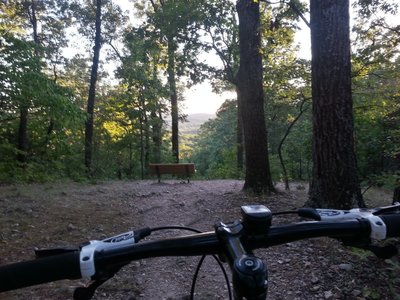 Looking at the bench and view downhill on the Flint Quarry trail
