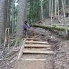 New hiking steps. While descending you'll come upon it around a blind corner with a slight uphill right hand corner. It goes clean but give it fast, lean back and ride the ripple.