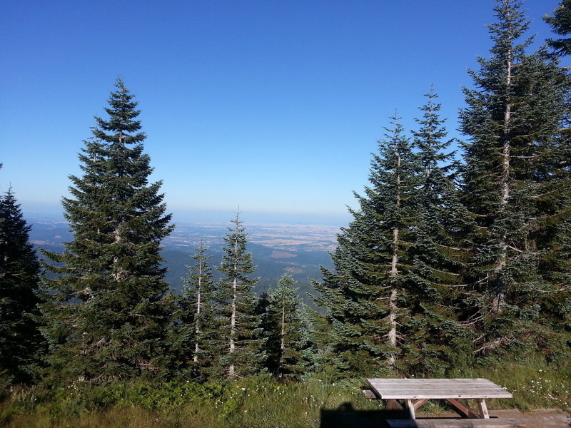 View from Mary's Peak Parking lot. Hazy day. Corvallis, Oregon in foreground, Cascade Volcanoes in the background. Ride up the road for a phenomenal 360 degree view on a clear day