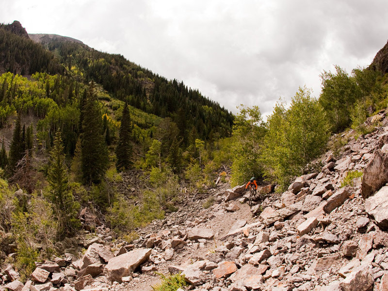 The lower reaches of Silver Creek feature some technical riding, including a big rock drop below a steep cliff.