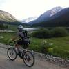 Riding past Grizzly Reservoir along Lincoln Creek Rd.  The road wraps around and continues towards the central horizon.