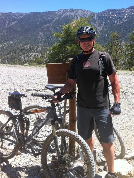 Me and my first MTB at the start of the singletrack, spring mountains in the background