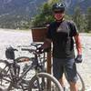 Me and my first MTB at the start of the singletrack, spring mountains in the background