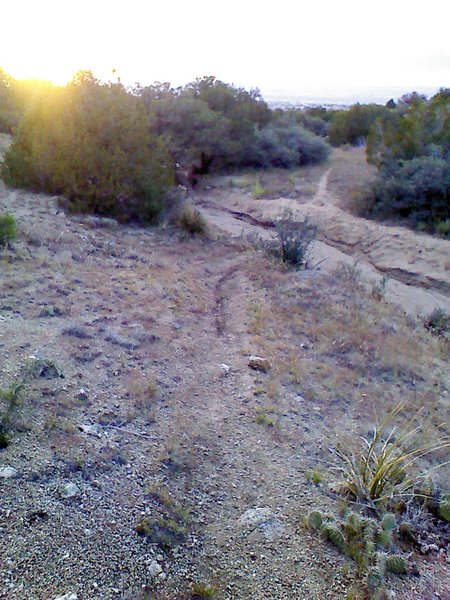 Descent to the arroyo crossing is steep and slick