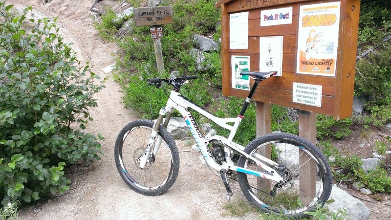 Top of Road climb before Chikamin DH.  This is the sign for the Chikamin Tie trail that climbs up and over to Mad Lake.  Start of the DH is across the road.