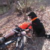 Spartacus watching over Taylor Davis as he takes a rest half way up "Charlotte's Hill of Pain" at MP 11 on the CW Trail. (fall 2011)