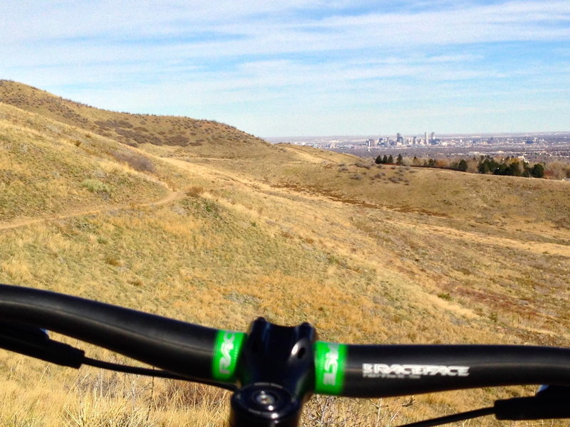 A lookout / resting spot with a distant view of Denver.