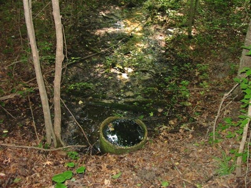 Old homestead's fresh water spring and cistern along the A Trail