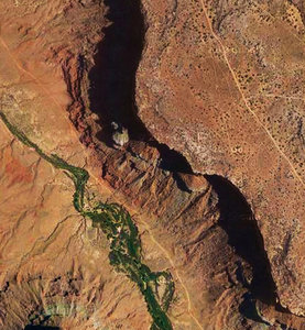 The trail (upper right) runs atop the impressive rim of Kane Canyon. There are a number of spur roads in this area to get out for a panoramic view, or maybe a BASE jump.