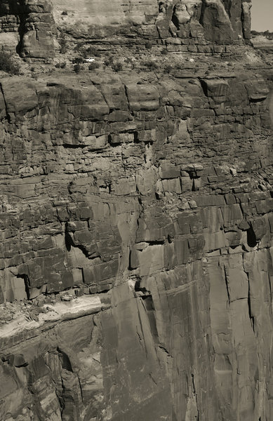 The shuttle vehicle follows along on the descent of Shafer Trail.