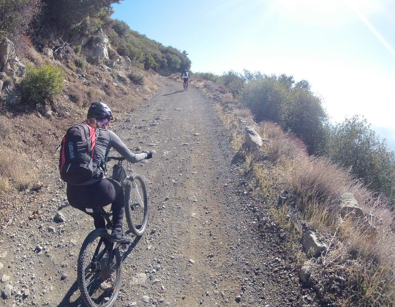 Just around the bend from the snow and ice the sun is shining fiercely, but now it's time to put on your climbing pants again because it won't stop until you reach the top!