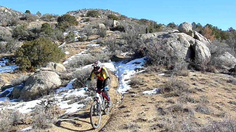 Downhill portion of the loop threads around and between boulders, with a few steep and loose sections