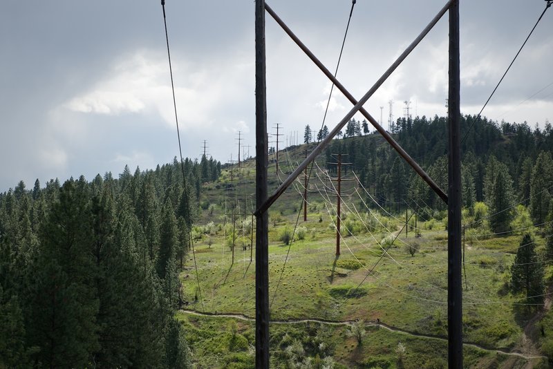 A barely distinguishable rider traverses across Good Behavior trail.