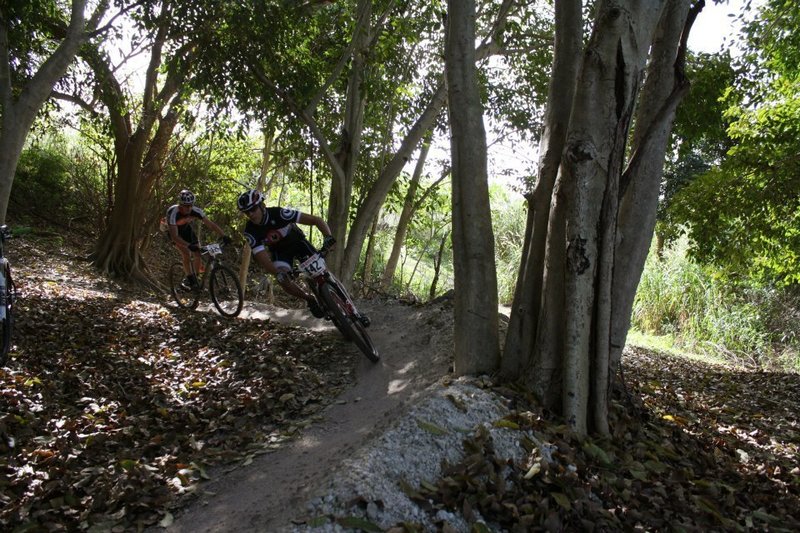 Racers take on one of many large berms in the park