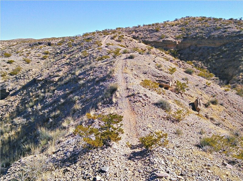 Snaking up a ridge between arroyos