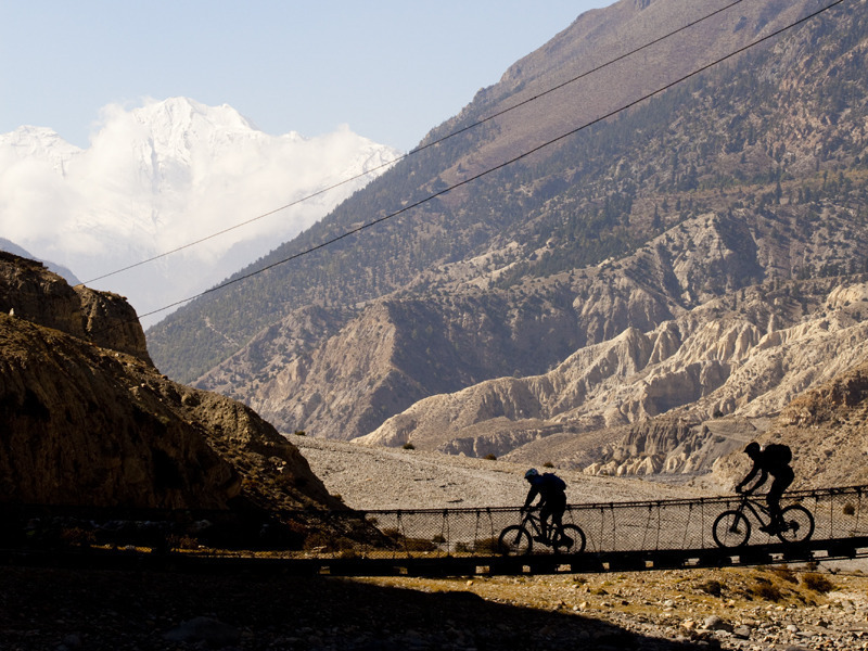 Crossing the Kali Gandaki River via suspension bridge