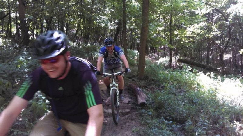 Two happy riders going over a newly installed rock armor project